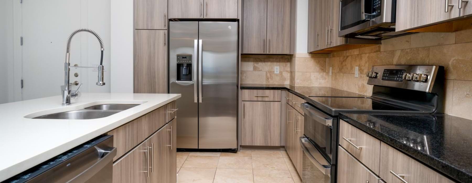 a kitchen with wooden cabinets