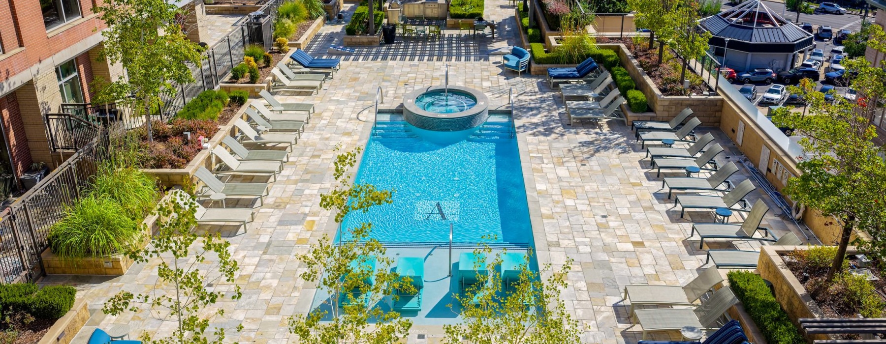 Resort-style swimming pool with lounge seating