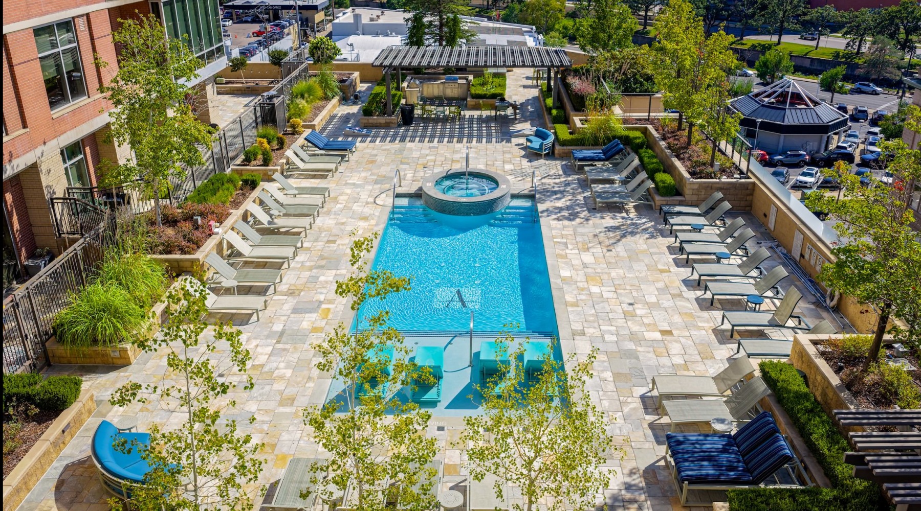 Resort-style swimming pool with lounge seating